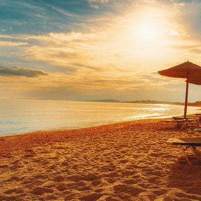 Blue Flag waters and golden sand at Nisos Beach Bar Fanari
